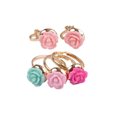 Great pretenders boutique rose rings & earring set, 3 rings, 1 set of clip on earrings